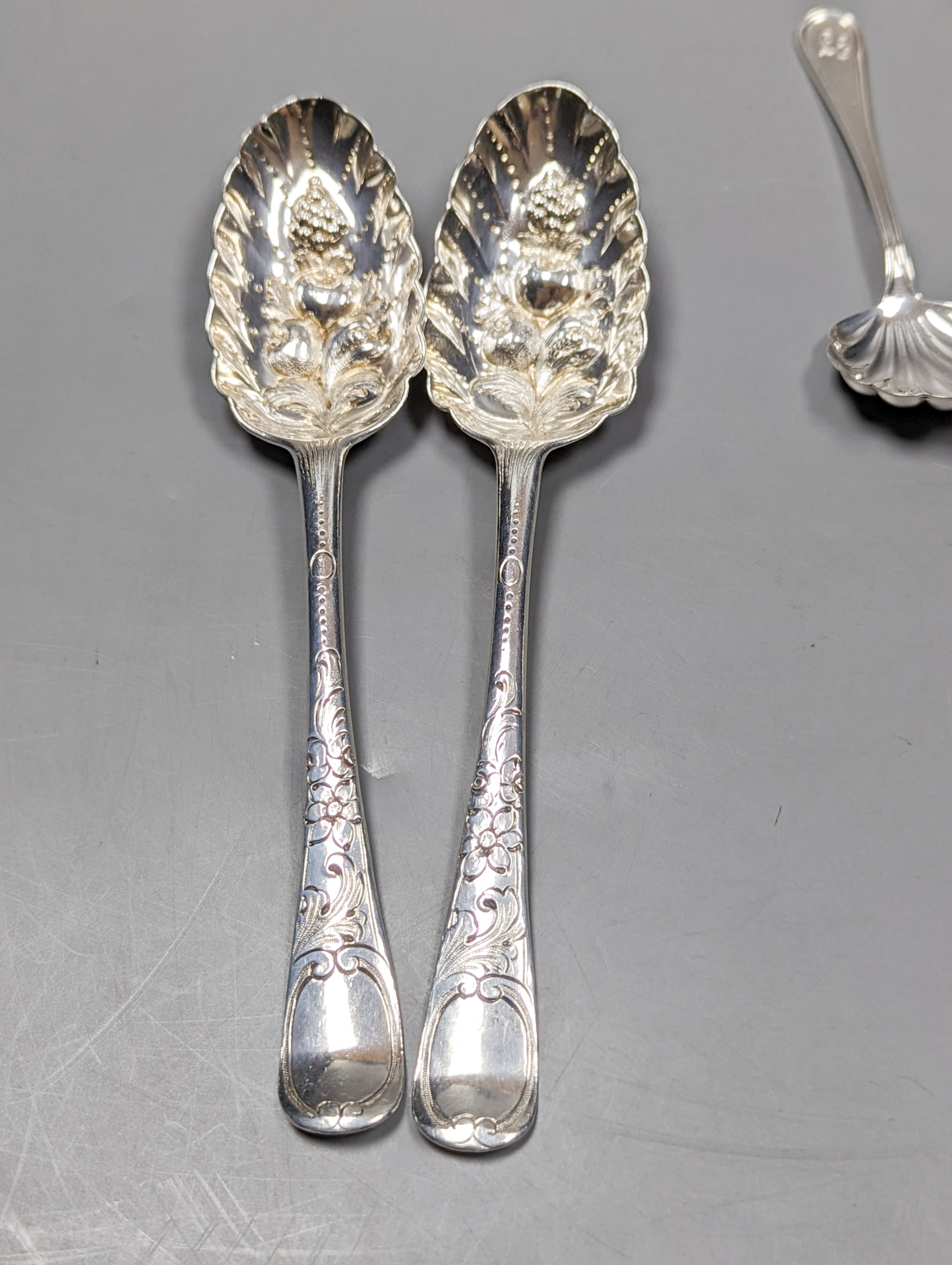 A pair of 18th century silver base mark 'berry spoons', marks pinched and sundry flatware including a Victorian silver pickle fork, a pair of silver sugar tongs, two 800 items of flatware and a pair Christofle plated sug